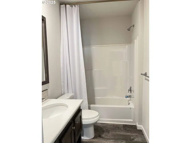 a bathroom with a sink a toilet and a bathtub