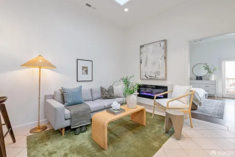 a living room with furniture and a rug