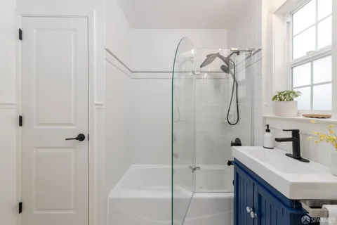 a bathroom with a sink and a shower