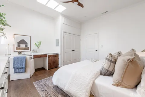 a bedroom with a bed and a dresser