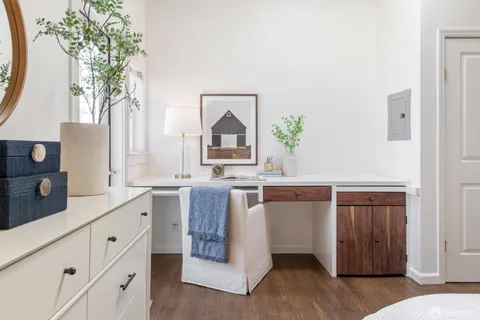 a spacious bathroom with a double vanity sink and a mirror