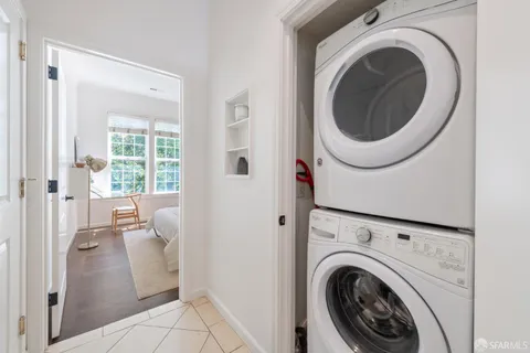 a view of a hallway with washer and dryer
