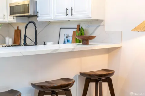 a kitchen with a sink and a stove