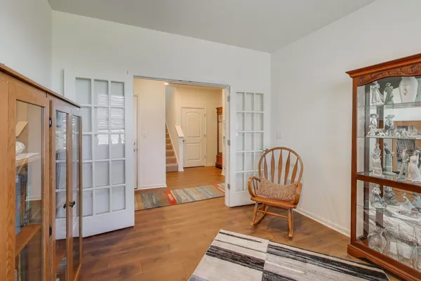 a view of a livingroom with furniture and hardwood floor