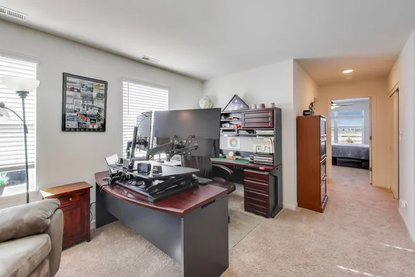 a kitchen with stainless steel appliances kitchen island granite countertop a stove and a refrigerator