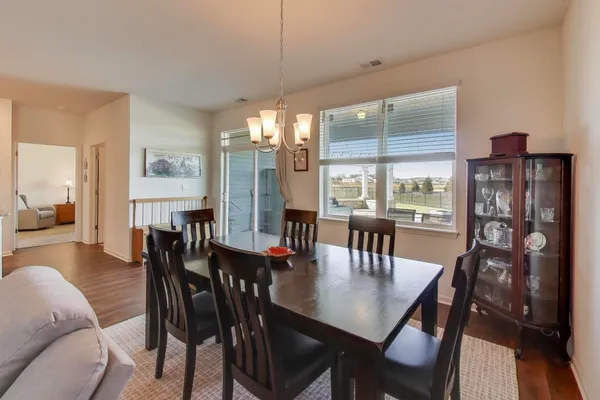a view of a dining room with furniture window and outside view