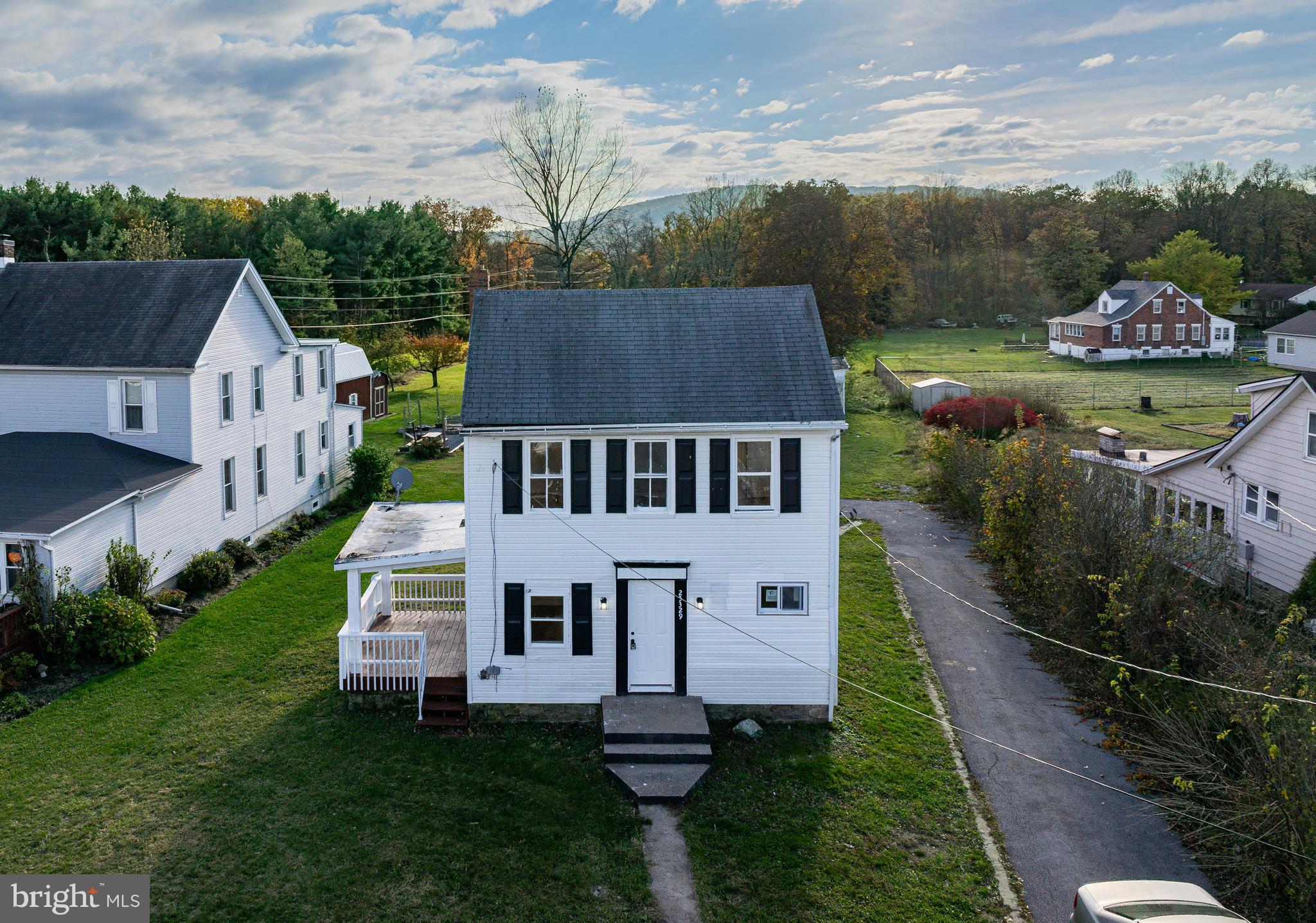 25329 Highfield Road Cascade, MD 21719 - Photo 13 of 51 a aerial view of a house with a yard table and chairs