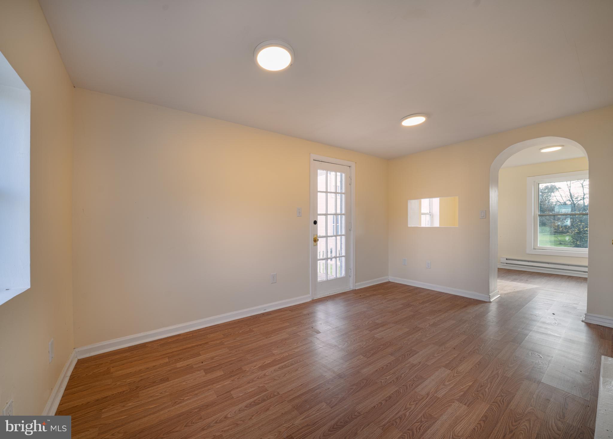 25329 Highfield Road Cascade, MD 21719 - Photo 16 of 51 an empty room with wooden floor and windows