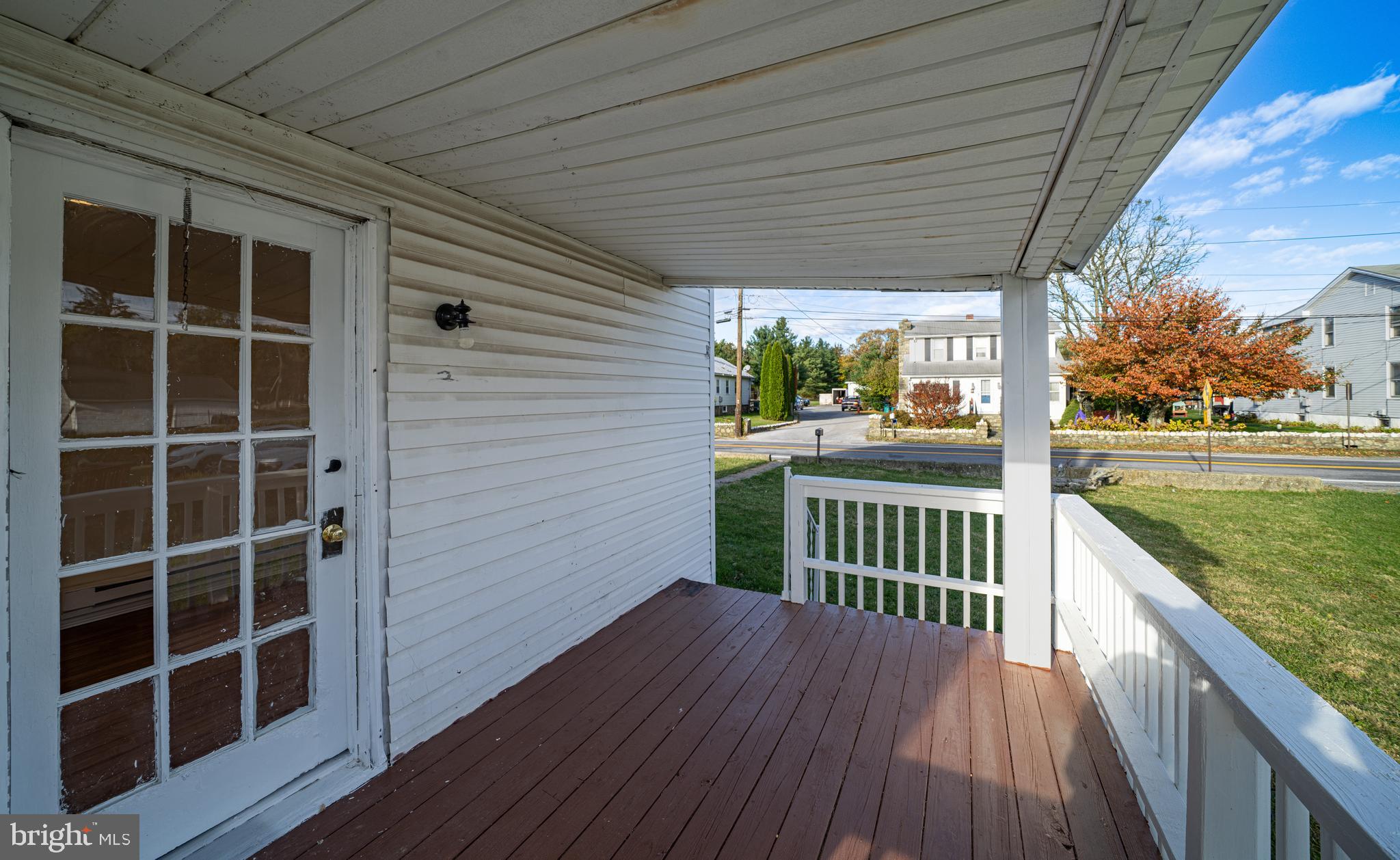 25329 Highfield Road Cascade, MD 21719 - Photo 19 of 51 a view of a porch with wooden floor and fence