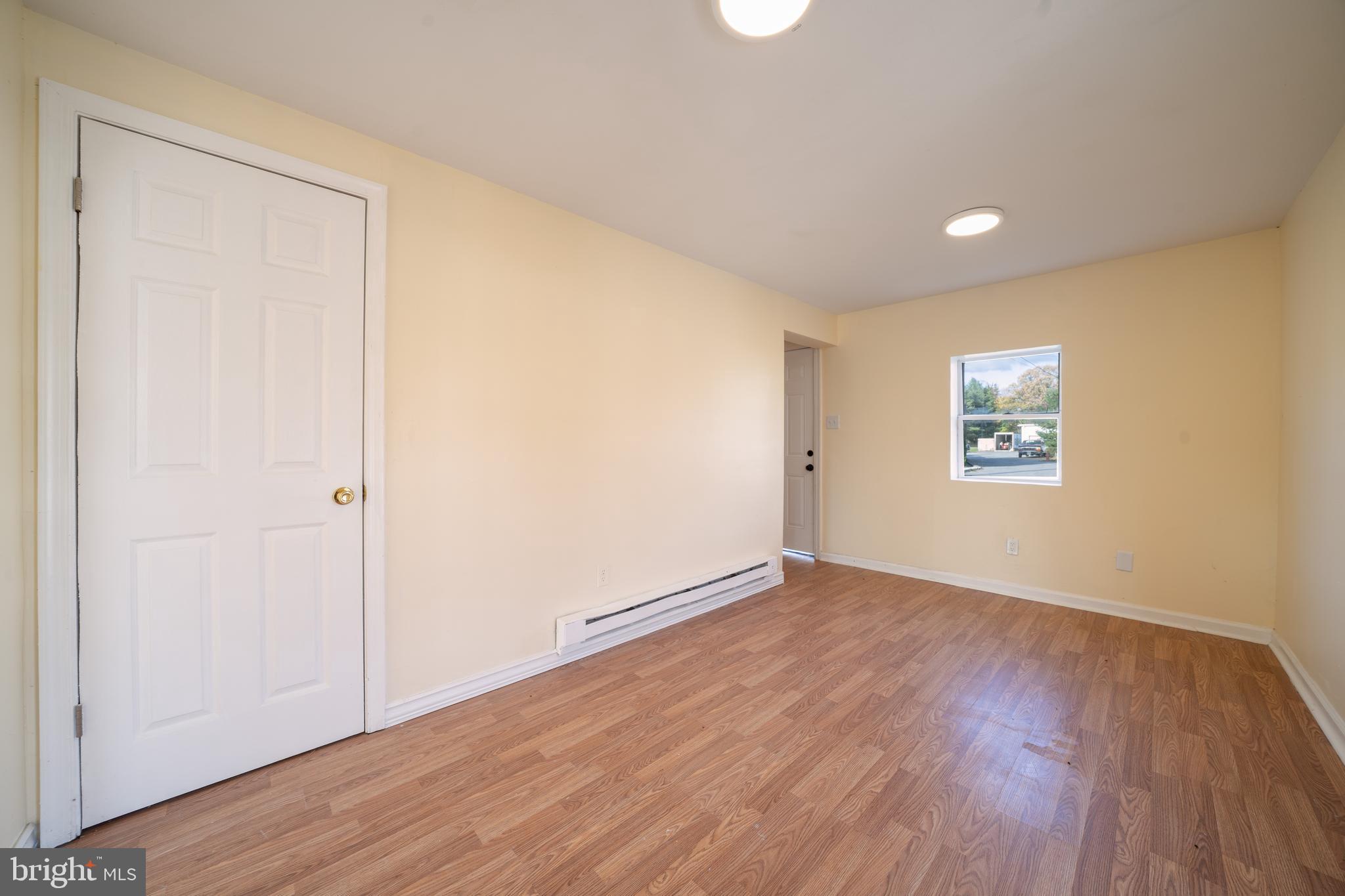 25329 Highfield Road Cascade, MD 21719 - Photo 20 of 51 an empty room with wooden floor and windows