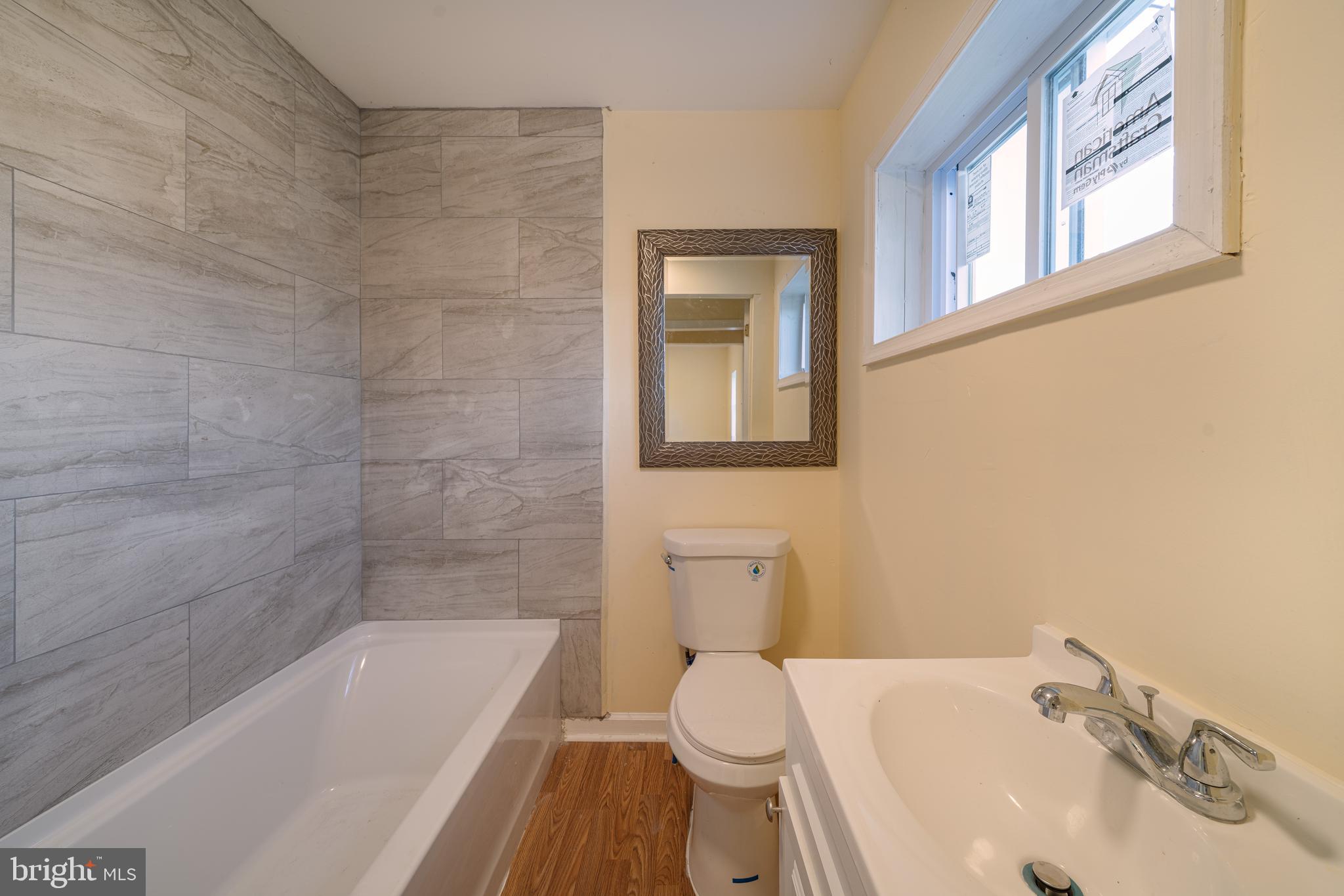 25329 Highfield Road Cascade, MD 21719 - Photo 23 of 51 a bathroom with a sink a toilet and bathtub