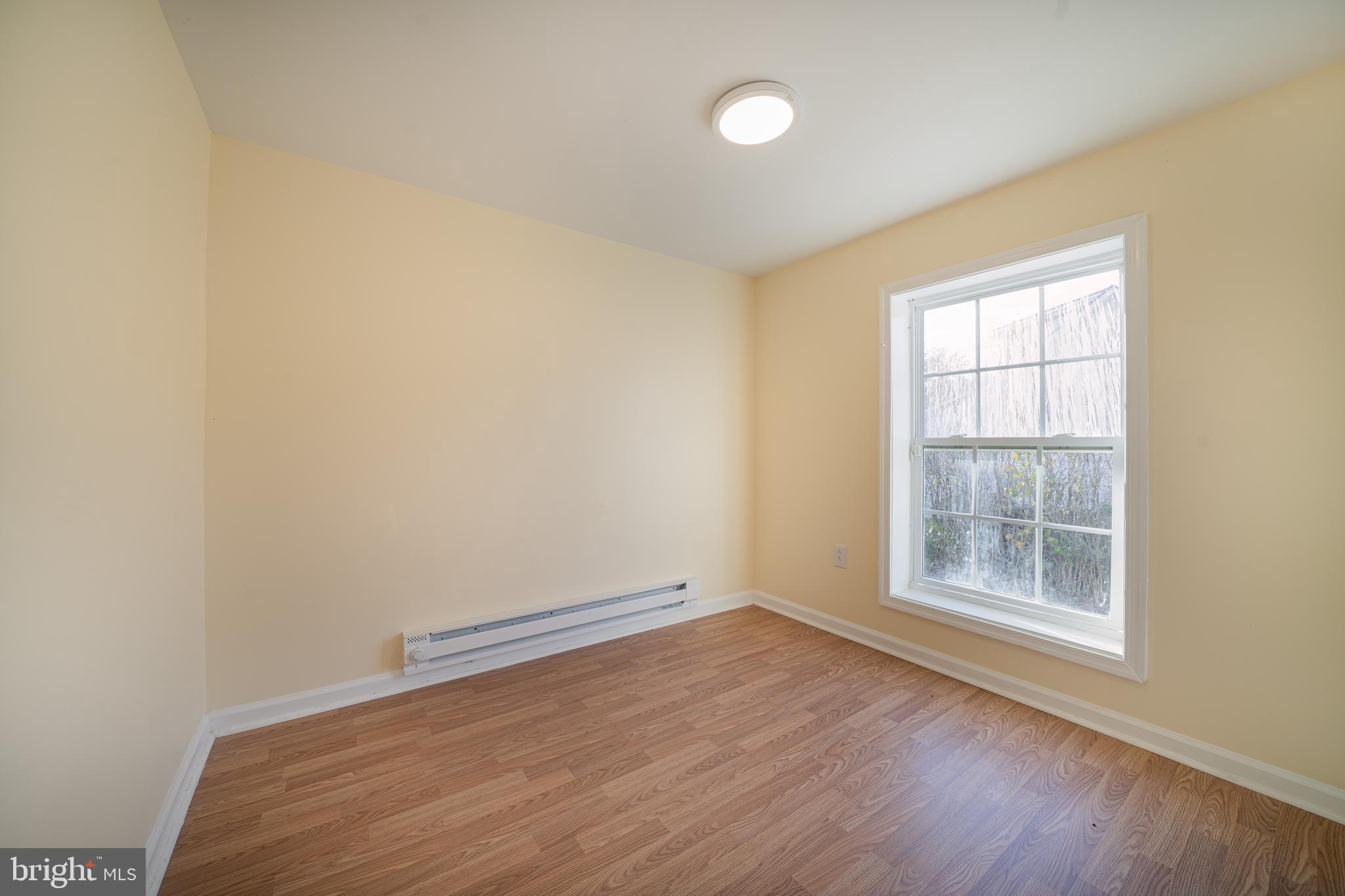 25329 Highfield Road Cascade, MD 21719 - Photo 24 of 51 an empty room with wooden floor and windows