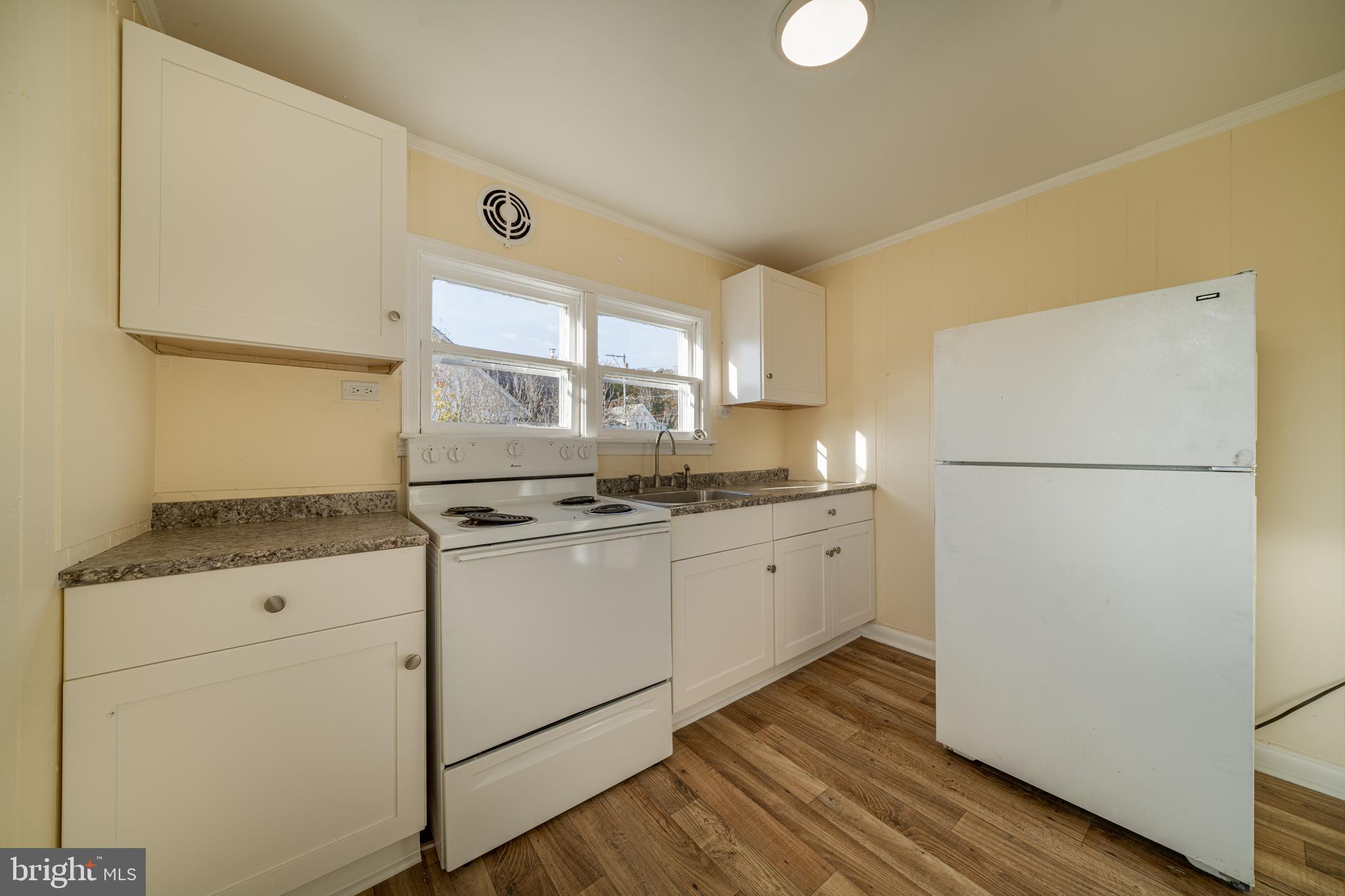 25329 Highfield Road Cascade, MD 21719 - Photo 29 of 51 a kitchen with granite countertop cabinets and refrigerator