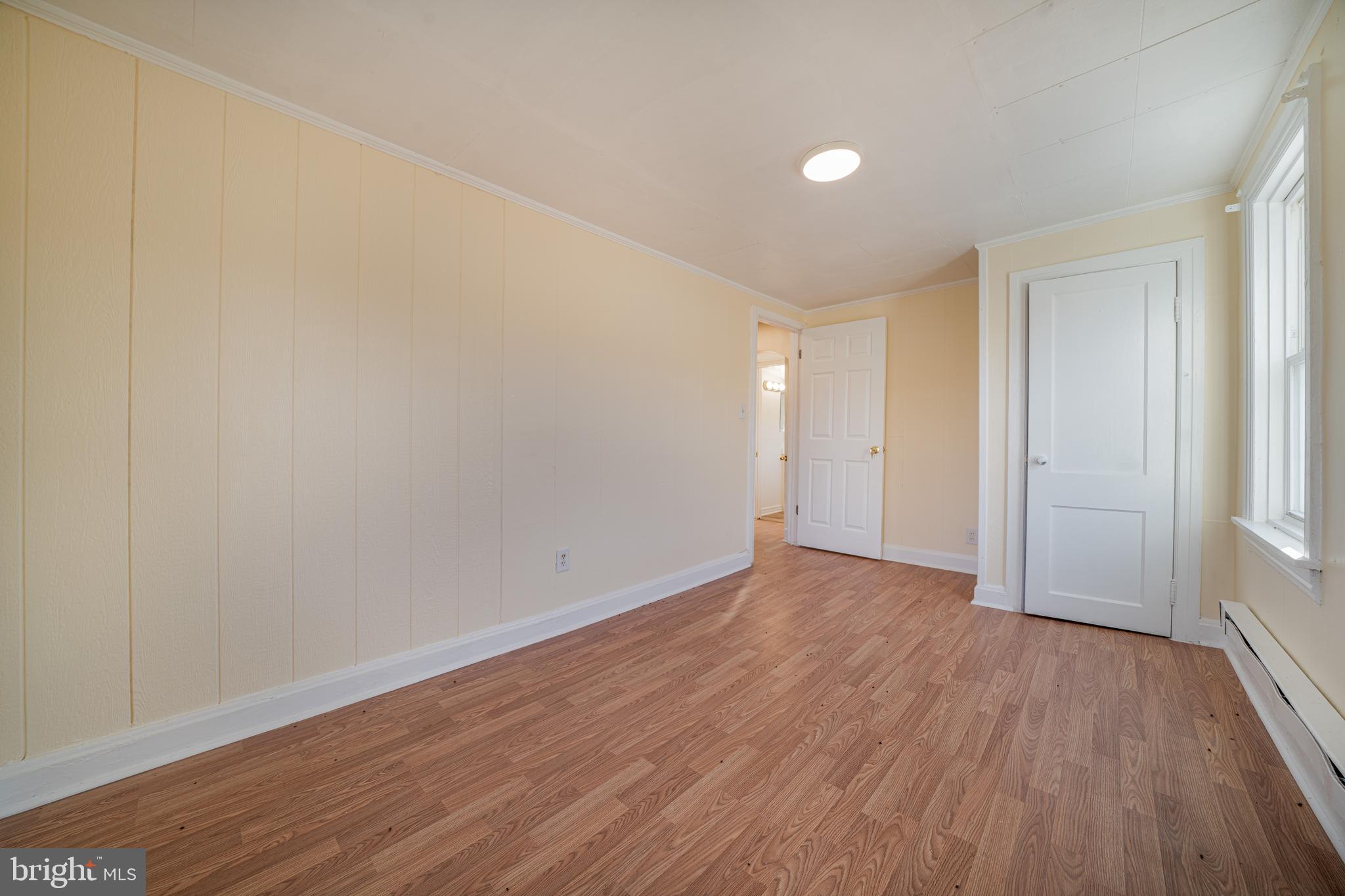 25329 Highfield Road Cascade, MD 21719 - Photo 40 of 51 a view of an empty room with wooden floor and a window