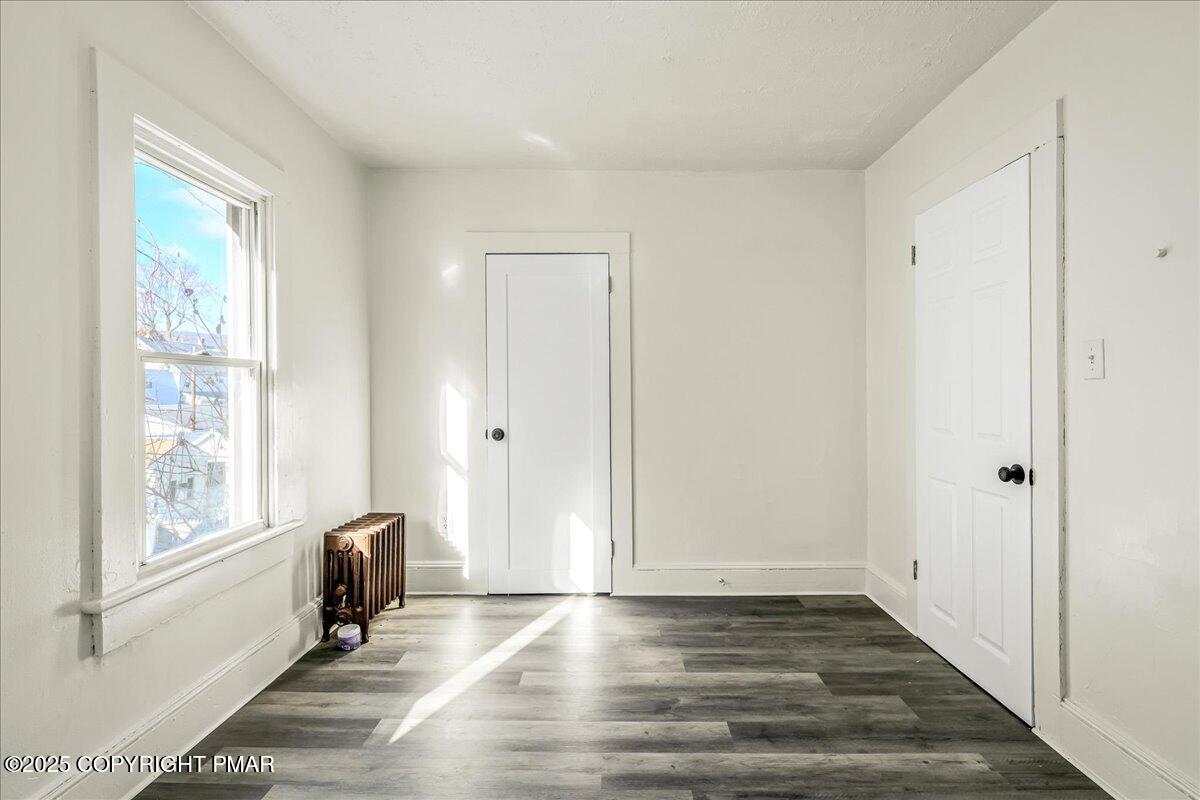 1057 Euclid Avenue Scranton, PA 18504 - Photo 14 of 23 a view of empty room with wooden floor and fan