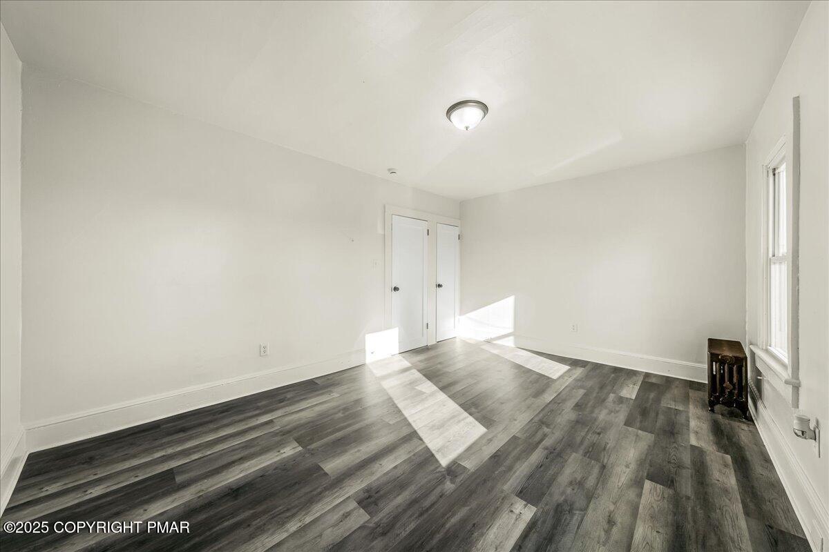 1057 Euclid Avenue Scranton, PA 18504 - Photo 16 of 23 a view of an empty room and wooden floor
