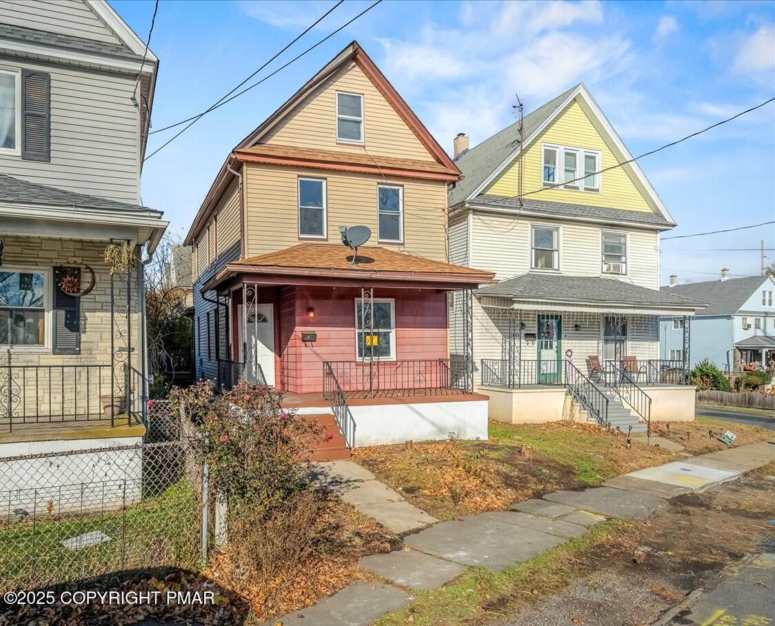 1057 Euclid Avenue Scranton, PA 18504 - Photo 22 of 23 a front view of a house with a yard and porch