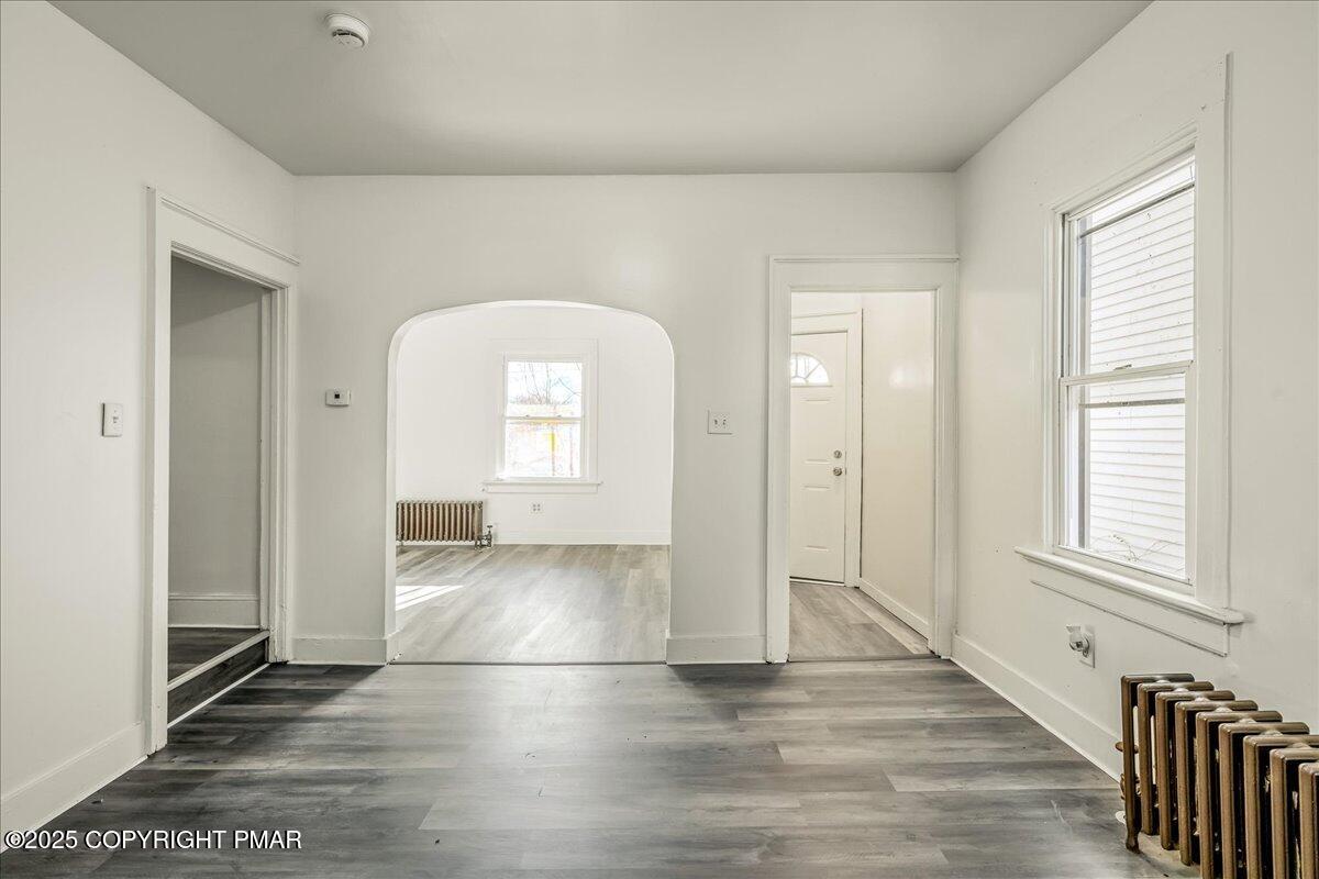 1057 Euclid Avenue Scranton, PA 18504 - Photo 4 of 23 a view of a livingroom with wooden floor and a window