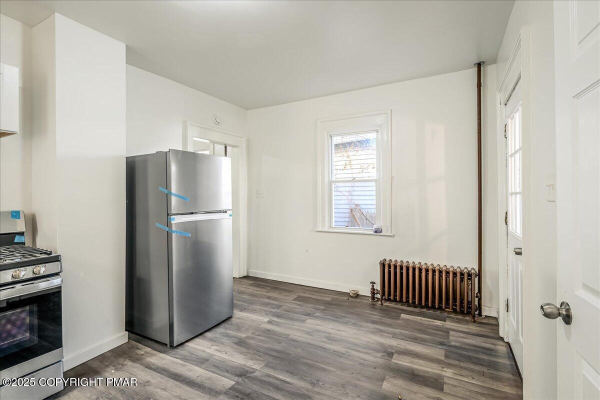 1057 Euclid Avenue Scranton, PA 18504 - Photo 8 of 23 a kitchen with a refrigerator and a window