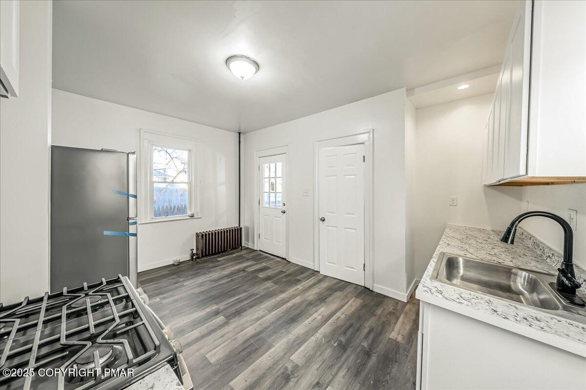 1057 Euclid Avenue Scranton, PA 18504 - Photo 9 of 23 a kitchen with a stove and a sink