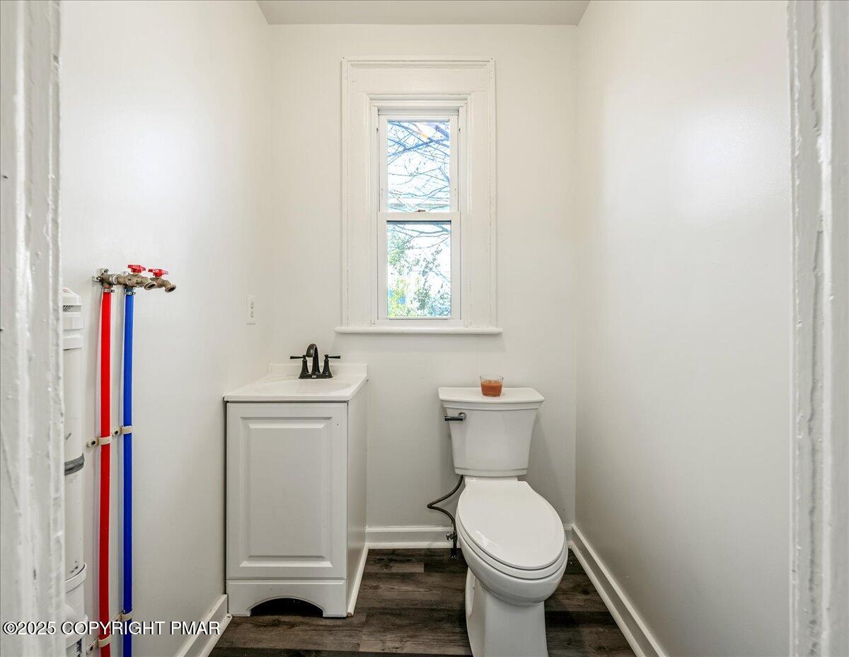 1057 Euclid Avenue Scranton, PA 18504 - Photo 10 of 23 a white toilet sitting next to a bathroom sink