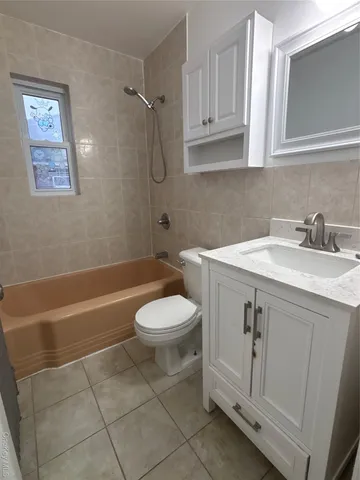 a bathroom with a sink a toilet and a bathtub
