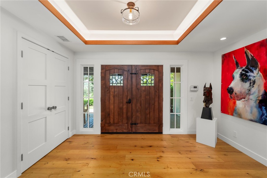 7337 La Soldadera Rancho Santa Fe, CA 92067 - Photo 21 of 60 a view of an entryway with wooden floor