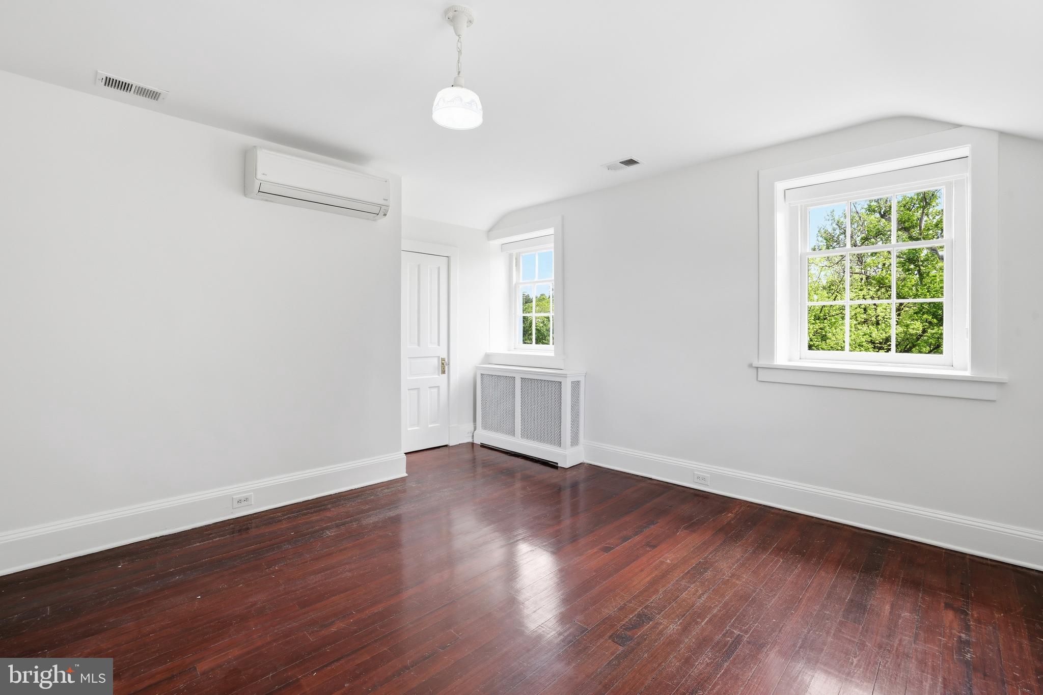 17781 Roxbury Hall Road Leesburg, VA 20175 - Photo 55 of 107 an empty room with wooden floor and windows