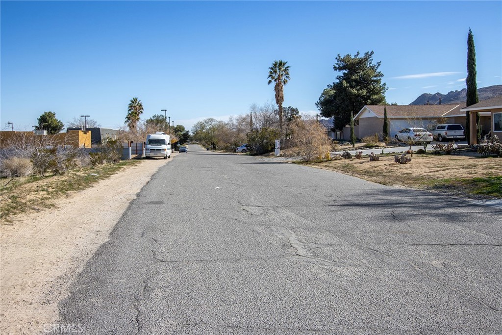 61480 Division Street Joshua Tree, CA 92252 - Photo 17 of 17 a view of a house with a yard and parking space