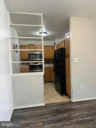 a kitchen with a refrigerator and a refrigerator