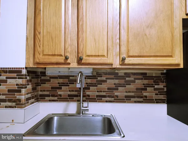 a kitchen with a sink and a window