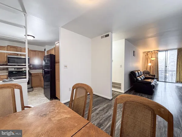 a bedroom with furniture and wooden floor