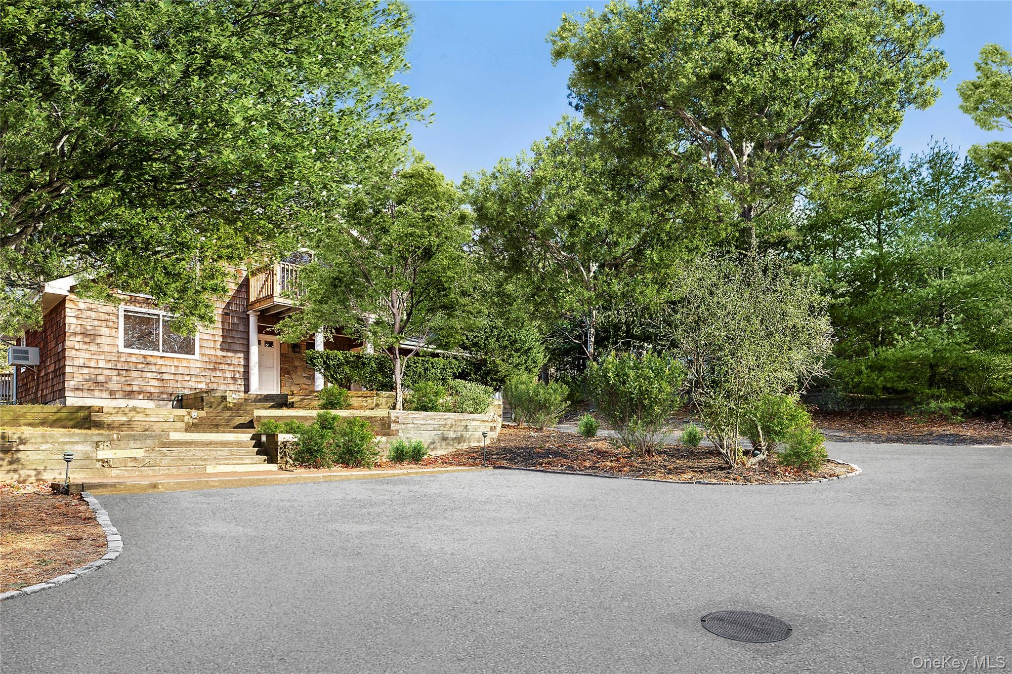 16 Peconic Road Hampton Bays, NY 11946 - Photo 12 of 13 a view of a house with a street view