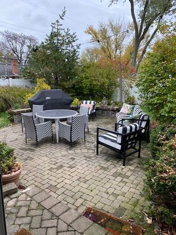 a view of a backyard with sitting area