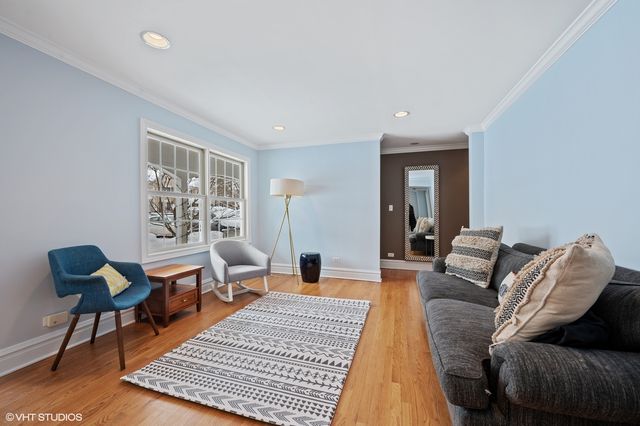 a living room with furniture and a rug