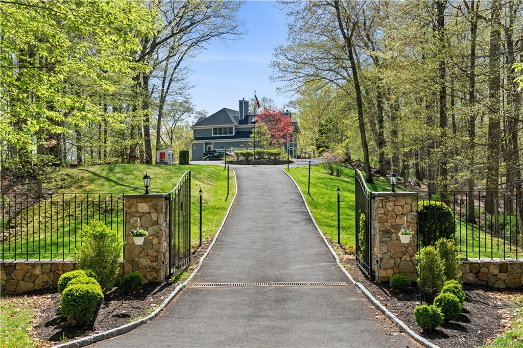 1515 Journeys End Road Croton-on-Hudson, NY 10520 - Photo 1 of 35 a view of a pathway with a wrought fence
