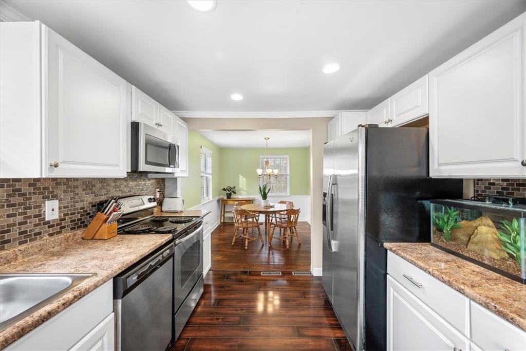 109 Hillendale Road Pittsburgh, PA 15237 - Photo 3 of 27 a kitchen with stainless steel appliances granite countertop a refrigerator a stove top oven a sink and dishwasher