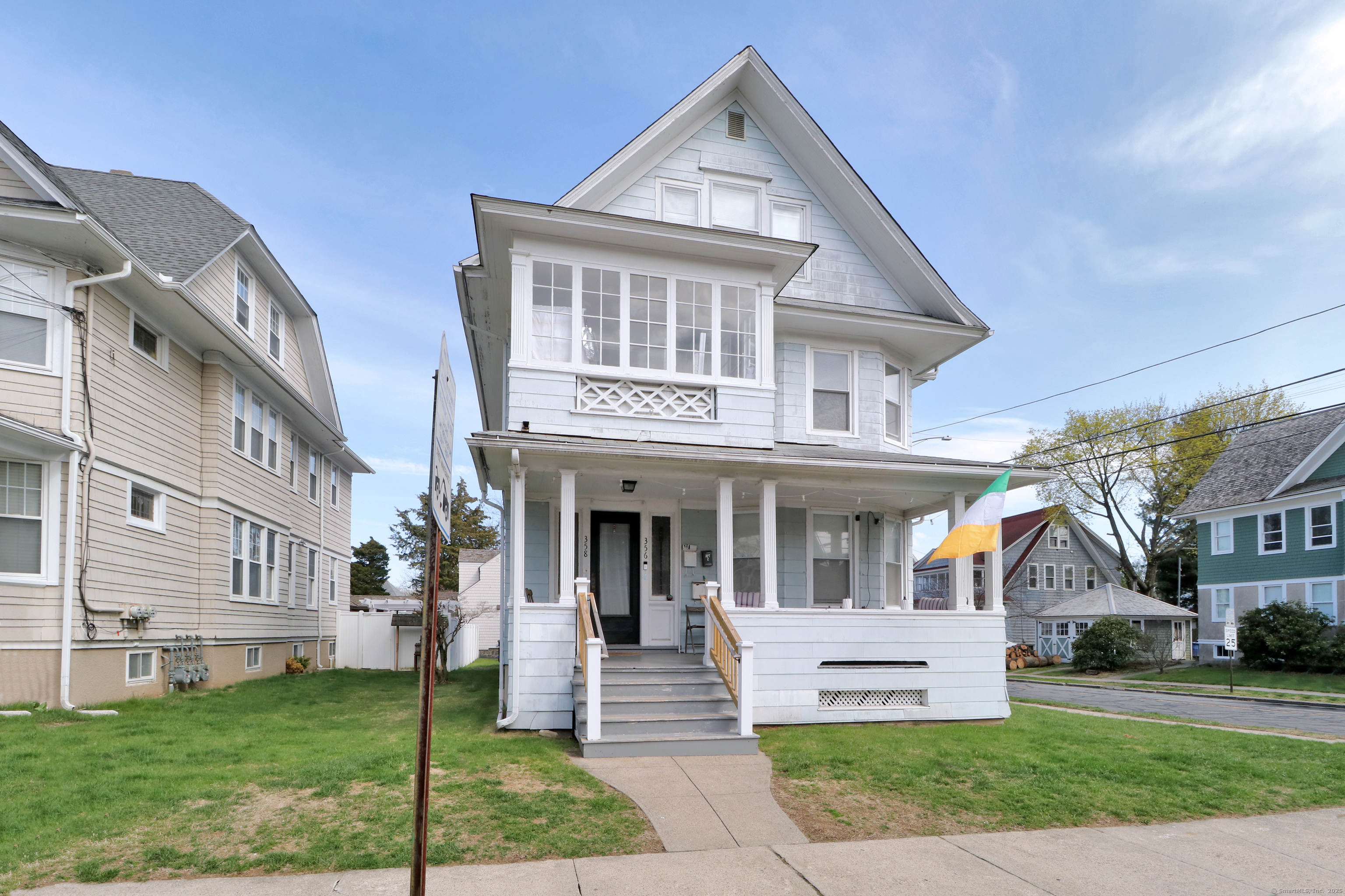 356-358 Midland Street, Unit 2 Bridgeport, CT 06605 - Photo 1 of 1 a front view of a house with a yard