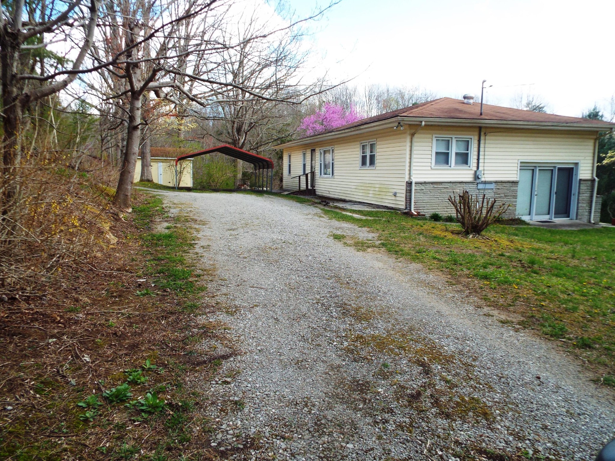 1445 West Cove Road Jamestown, TN 38556 - Photo 24 of 30 a view of a house with a yard