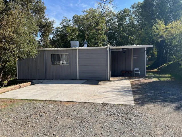 a house with trees in front of it