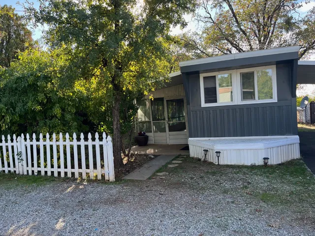 a house view with a backyard space