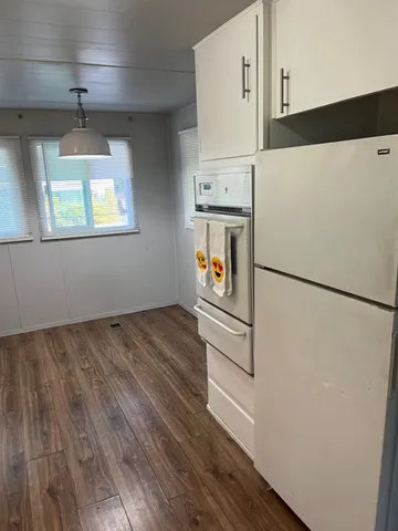 a hallway with washer and dryer