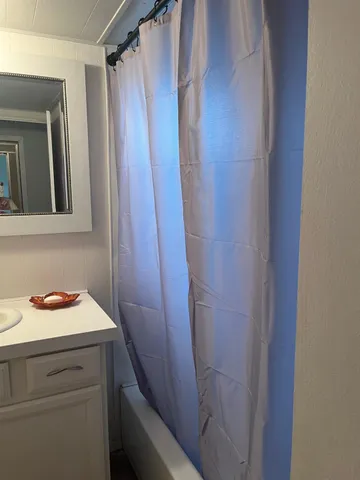 a bathroom with a sink and mirror