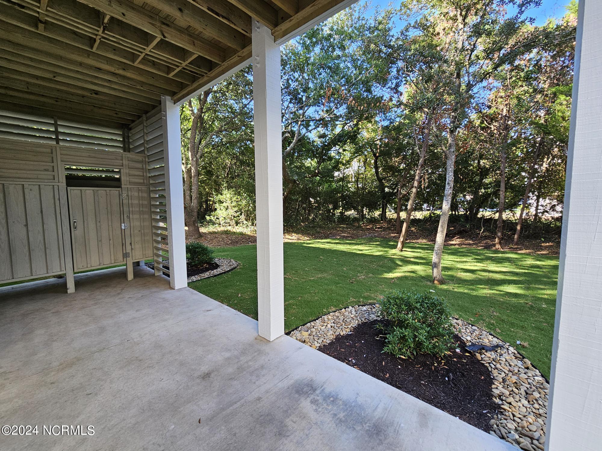 121 Atkinson Road Surf City, NC 28445 - Photo 58 of 70 Backyard and Private Outdoor Shower