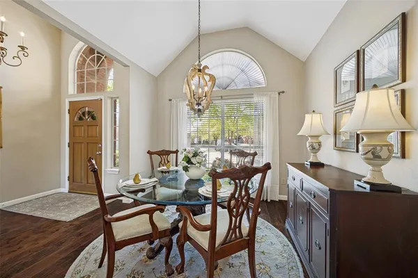 a view of a livingroom with furniture window and wooden floor
