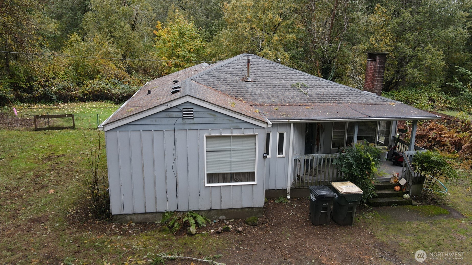 3225 Cooper Point Road Northwest Olympia, WA 98502 - Photo 20 of 40 a front view of a house with garden