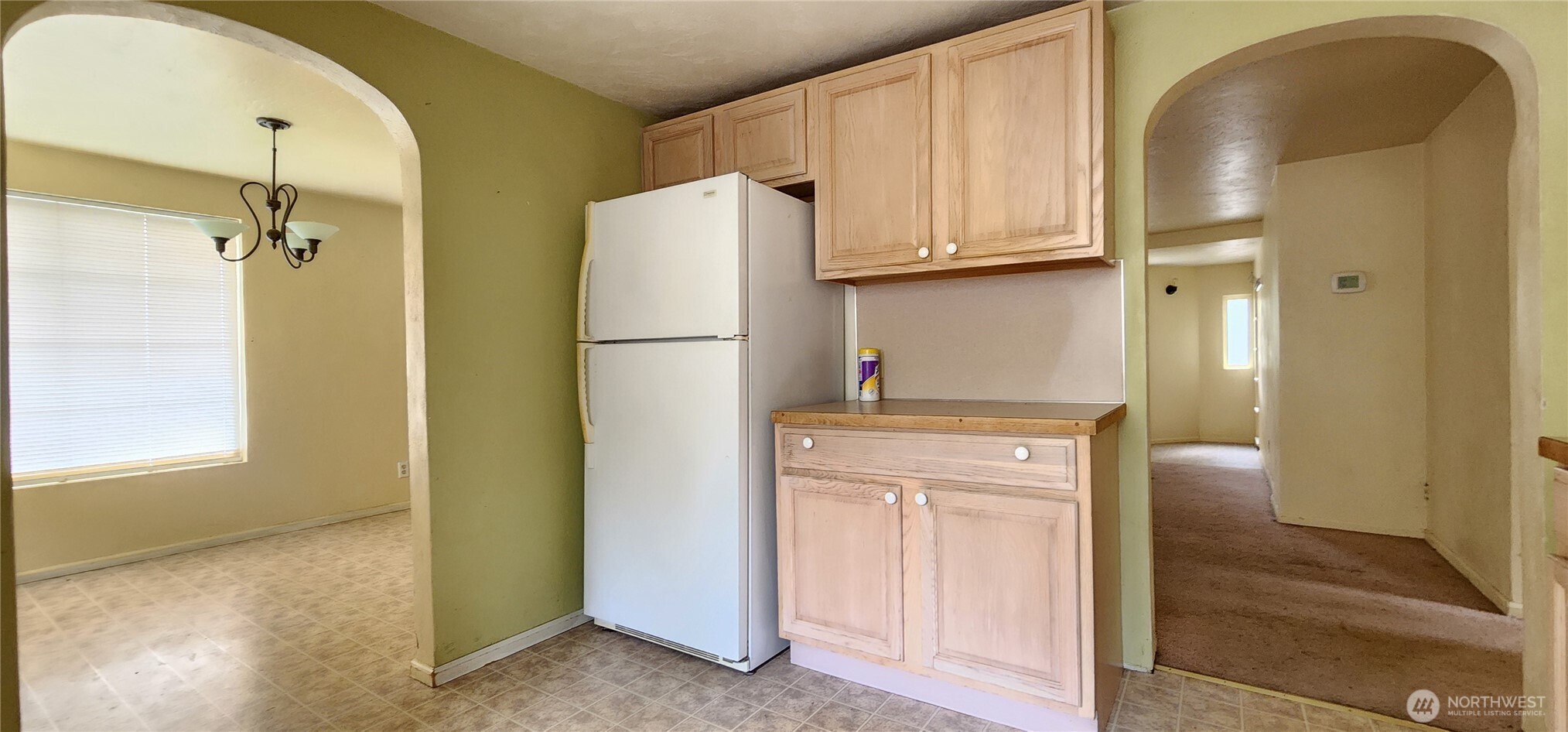 3225 Cooper Point Road Northwest Olympia, WA 98502 - Photo 26 of 40 a view of a kitchen with refrigerator and cabinet