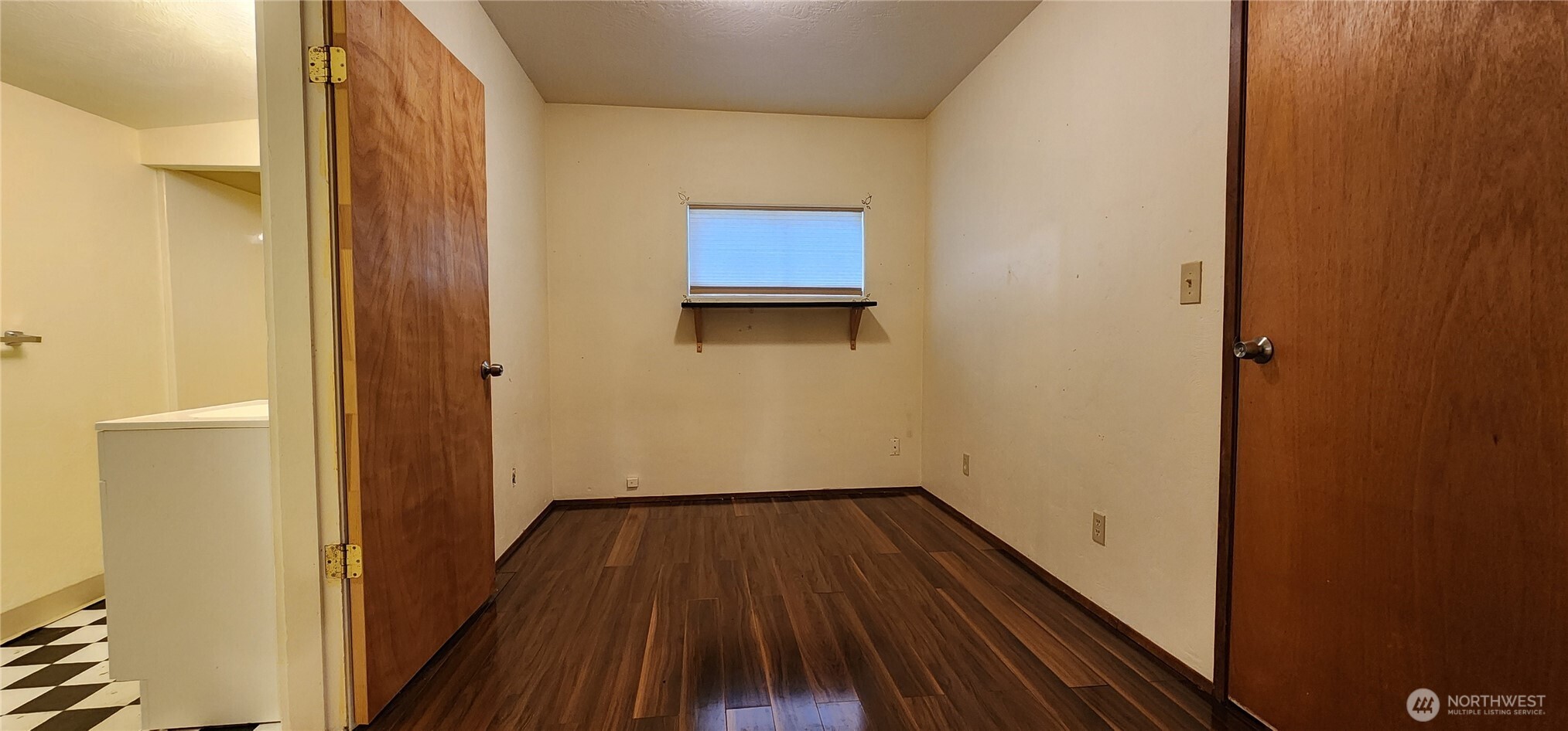 3225 Cooper Point Road Northwest Olympia, WA 98502 - Photo 32 of 40 a view of a hallway with wooden floor