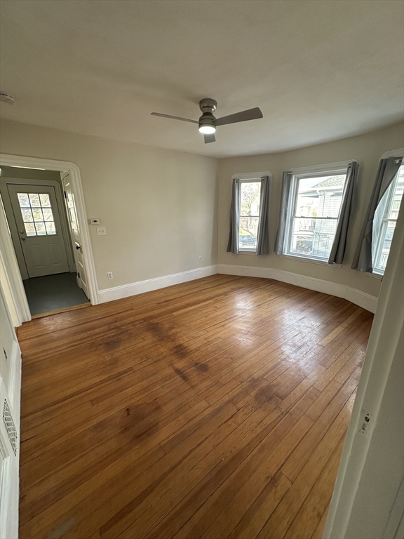 9 Station Road, Unit 2 Salem, MA 01970 - Photo 20 of 21 wooden floor in an empty room with a window