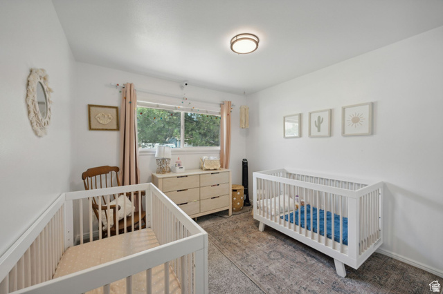 495 North 250 West Springville, UT 84663 - Photo 12 of 35 Bedroom featuring a crib and dark colored carpet